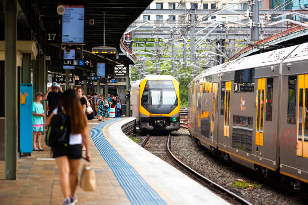 train staion with passengers and trains getting in and out of the train staion stock photo
