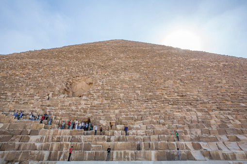Cairo, Égypt - November 04, 2018 : tourists do not just admire the pyramids from far away, they also want to go up there and get as high as possible. We see the nlocked entrance to a Pyramid in Cairo Egypt.