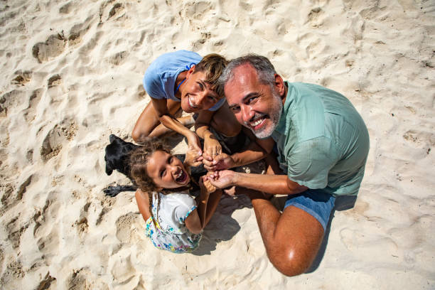 istock Family Enjoying on Summer Vacations With a Dog 1097136178