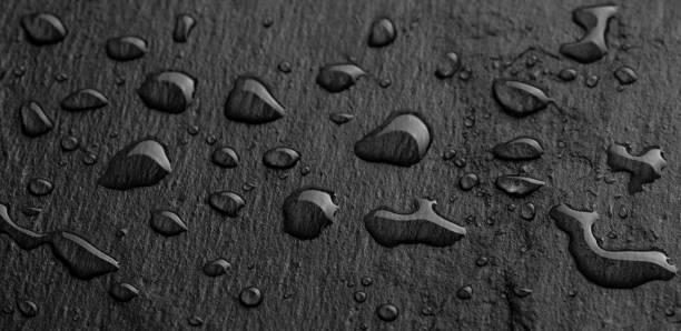 istock Dark gray black slate background or texture of natural stone. 1097147514
