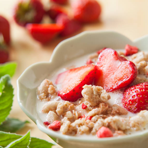 istock Healthy Muesli with raspberry, strawberry, red fruit and mint - ideas for breakfast. 1097152116