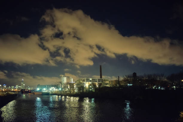 istock Dramatic industrial landscape with the skyline by the Chicago river at night 1097156498