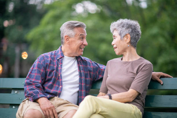 istock Senior couple talking on a bench 1097160470
