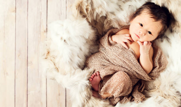 istock Newborn baby boy in a basket 1097161894