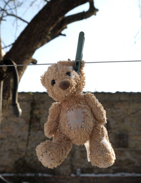 istock old teddy bear hanging on a clothesline 1097162866
