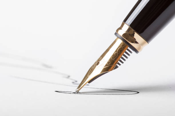 istock pen signing white paper 1097163434