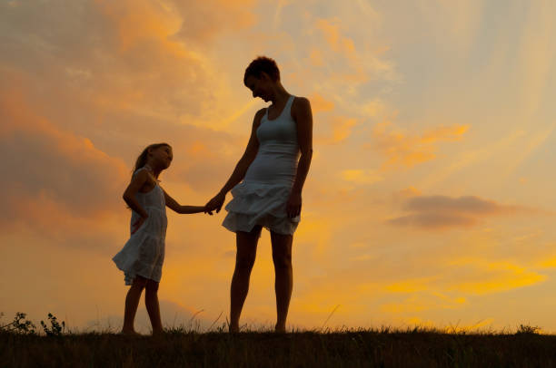 istock Mother and daughter in the spring nature 1097166848