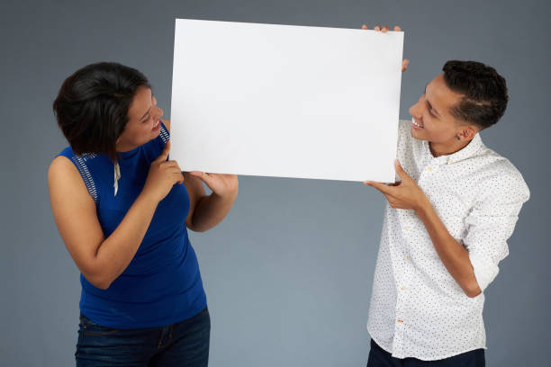 istock Smiling people look at banner 1097167108