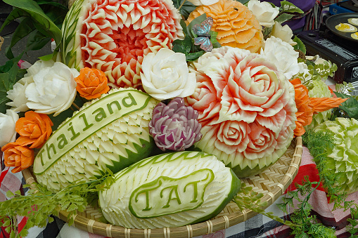 Melons and fruit carved to look like flowers at a festival commemorating Thailand.