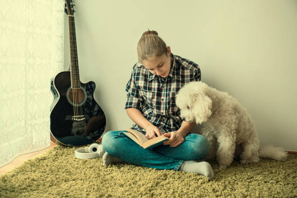 istock Teenager  reading a book 1097174888