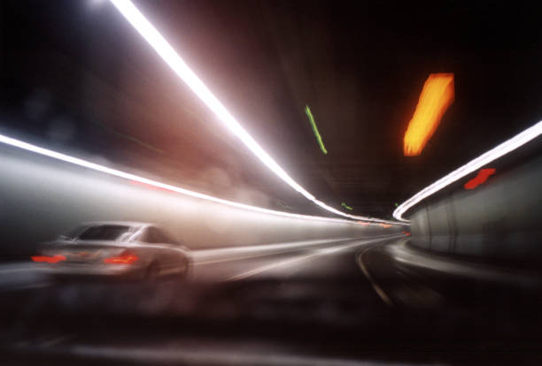 Motion Blur of Cars Driving Through Tunnel stock photo