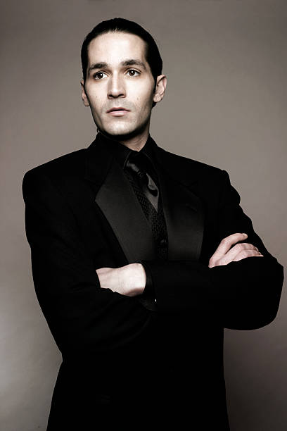 istock Man Wearing Black Tuxedo with Folded Arms 109717818
