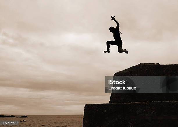 I Can Fly Silhouette Of Boy Cliff Diving Stock Photo - Download Image Now - Cliff Jumping, Jumping, Achievement