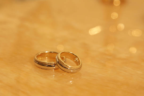 istock Gold wedding rings for newlyweds on the table 1097179918