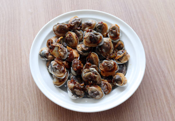 Boiled cockle cooked with soy sauce.