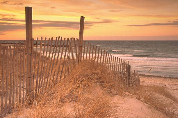 istock Picket Fence Along Sand Dune in Grass at Beach 109718235