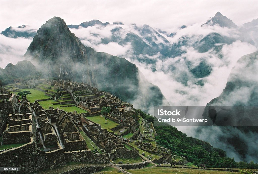 Clouds Surrounding Machu Picchu and Inca Ruins  Machu Picchu Stock Photo
