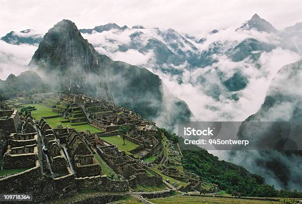 Clouds Surrounding Machu Picchu And Inca Ruins Stock Photo - Download Image Now - Machu Picchu, Sunrise - Dawn, Mt Huayna Picchu
