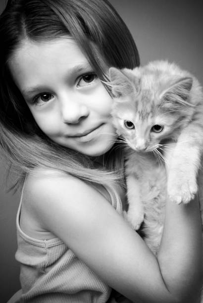istock Little Girl Holding Her Kitty 109718419