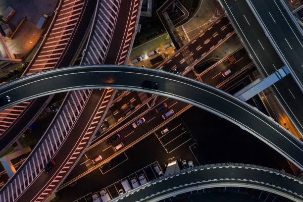 night photograph of complicated intersecting highway. - city vitality speed highway imagens e fotografias de stock
