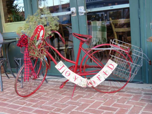 Red bicycle Christmas decoration Joy in Grapevine, Texas, USA Grapevine, Texas, USA -- December 22, 2018: Downtown Grapevine is decked out for holiday shoppers. The town is a suburb city of Fort Worth and Dallas, Texas. grapevine texas city stock pictures, royalty-free photos & images