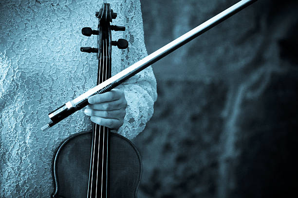 istock Woman Holding Violin 109718600
