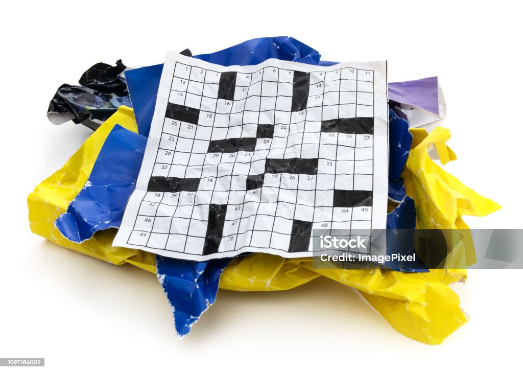 Isolated Crumpled Torn Crossword Puzzle Paper Cut Out Stock Photo