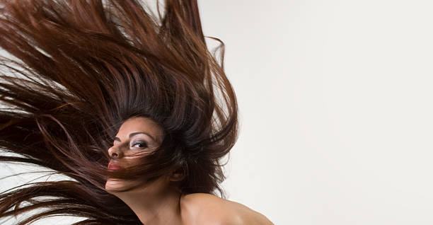 istock Young Woman's Long Brown Hair in Motion 109718695
