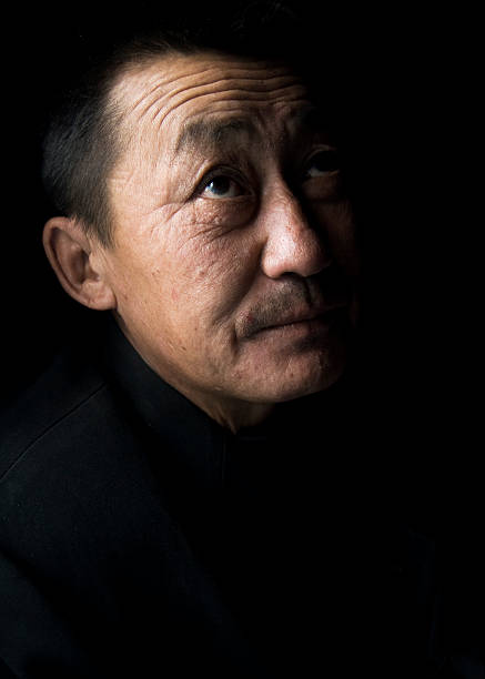 porträt von mongolische mann, low key - rawpixel stock-fotos und bilder