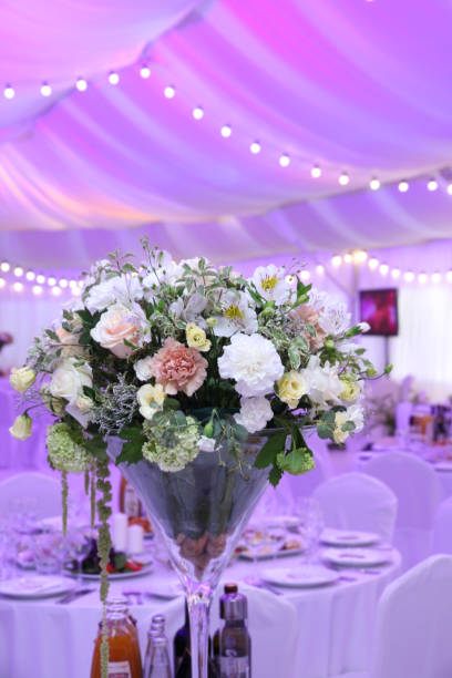 istock Wedding decor with flowers in the tent with neon lights 1097187984