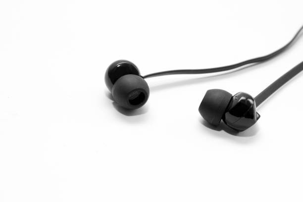 istock Black Bluetooth headphones isolated on white background. Side view 1097188226