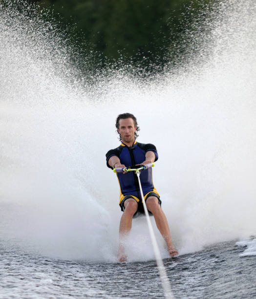 man towed 裸足でのボート - water ski ストックフォトと画像