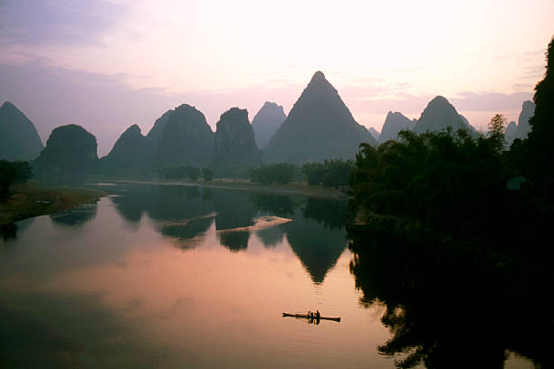 istock Fisherman on River at dawn, China 109718932