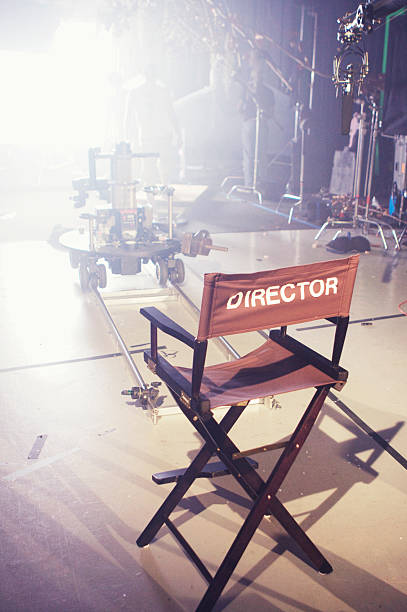 Director's Chair on Movie and Television Set A director's chair on a film set. film studio stock pictures, royalty-free photos & images