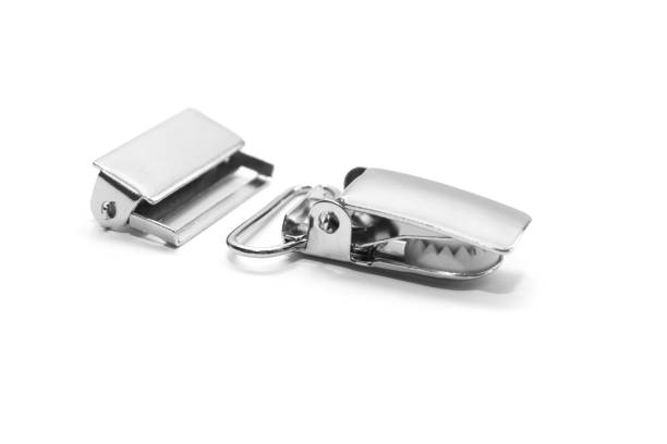istock Metal clips for suspenders isolated on white background. Side view. 1097191250