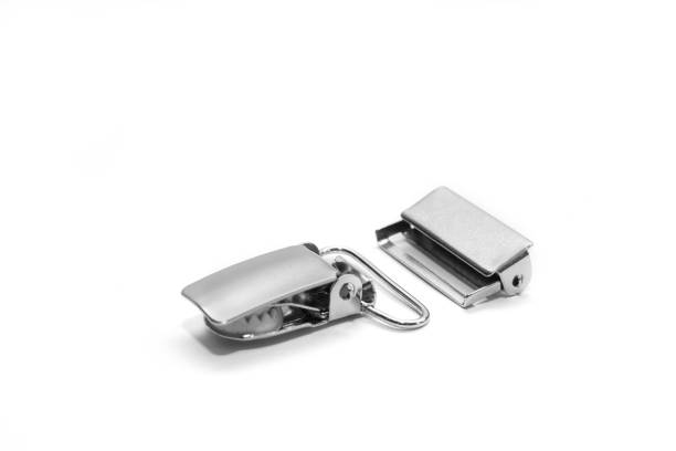 istock Metal clips for suspenders isolated on white background. Side view. 1097191260