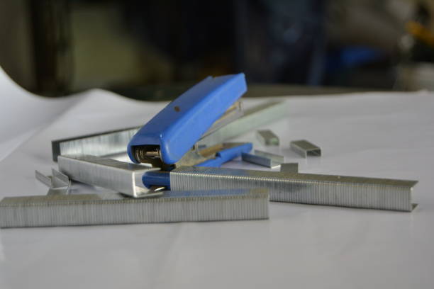 istock Blue stapler and staples on a white background 1097191528
