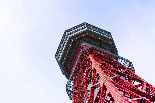 Asia Business concept for real estate and corporate construction - looking up view of hakata port tower in fukuoka, japan