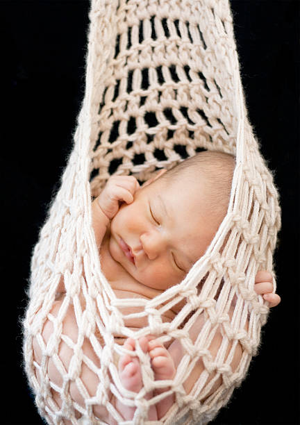 istock Newborn in knit pouch 109719241