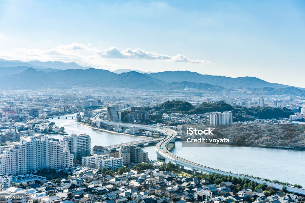 moden city skyline aerial view in Fukuoka Japan Asia Business concept for real estate and corporate construction - panoramic urban townscape aerial view under bright blue sky and sun in Fukuoka Japan Hakata-ku - Fukuoka Prefecture Stock Photo