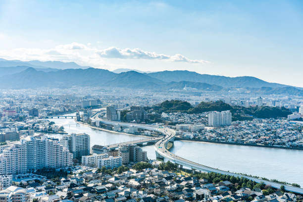 moden city skyline aerial view in Fukuoka Japan Asia Business concept for real estate and corporate construction - panoramic urban townscape aerial view under bright blue sky and sun in Fukuoka Japan fukuoka city photos stock pictures, royalty-free photos & images