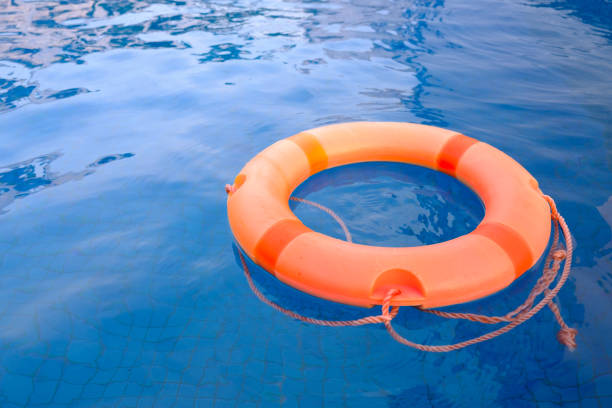 istock life ring floating in the empty swimming pool for relax peaceful the concept. 1097196368