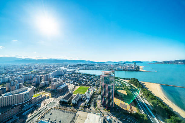 moden city skyline aerial view in Fukuoka Japan Asia Business concept for real estate and corporate construction - panoramic urban townscape aerial view of beach park under bright blue sky and sun in Fukuoka Japan fukuoka city photos stock pictures, royalty-free photos & images