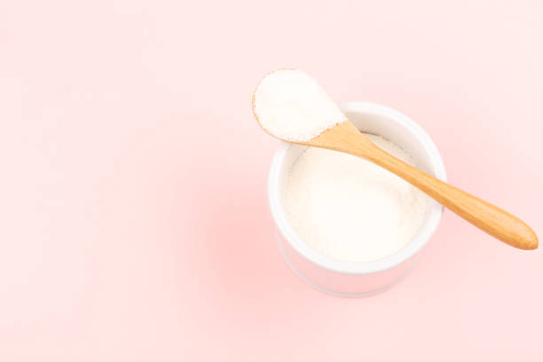 istock Collagen powder on pink background 1097199626