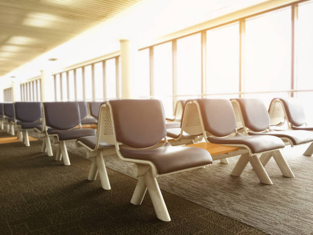 istock empty people in international airport terminal with sunlights. 1097199658