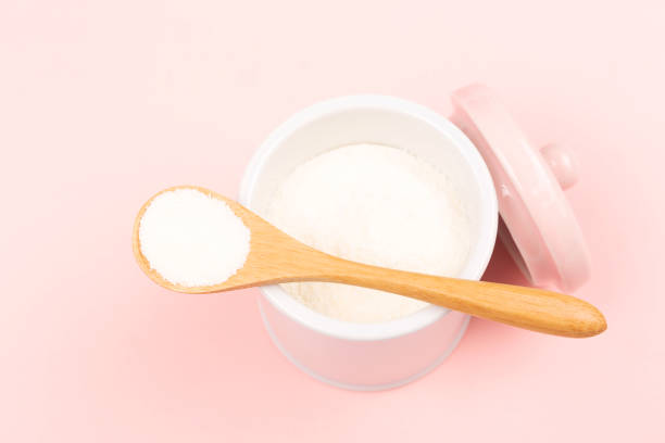 istock Collagen powder on pink background 1097199812