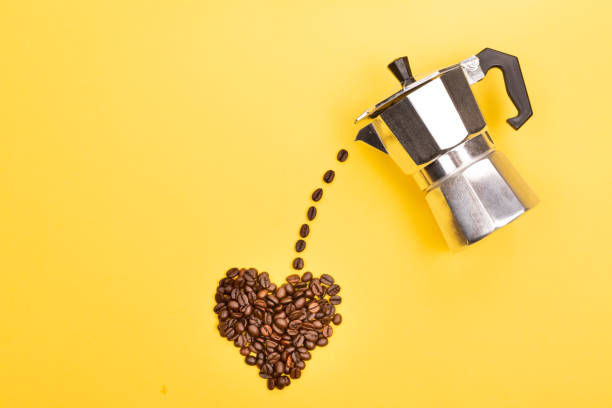 coffee maker and beans - pouring coffee liquid coffee bean imagens e fotografias de stock