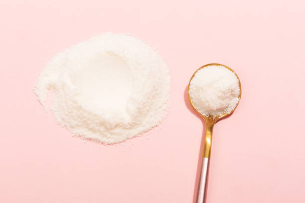 istock Collagen powder on pink background 1097201574