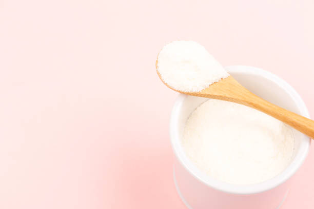 istock Collagen powder on pink background 1097201686