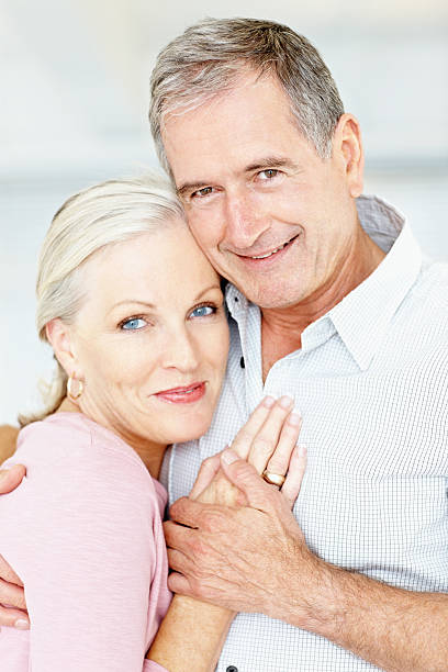 istock Smiling retired couple embracing each other 109720384